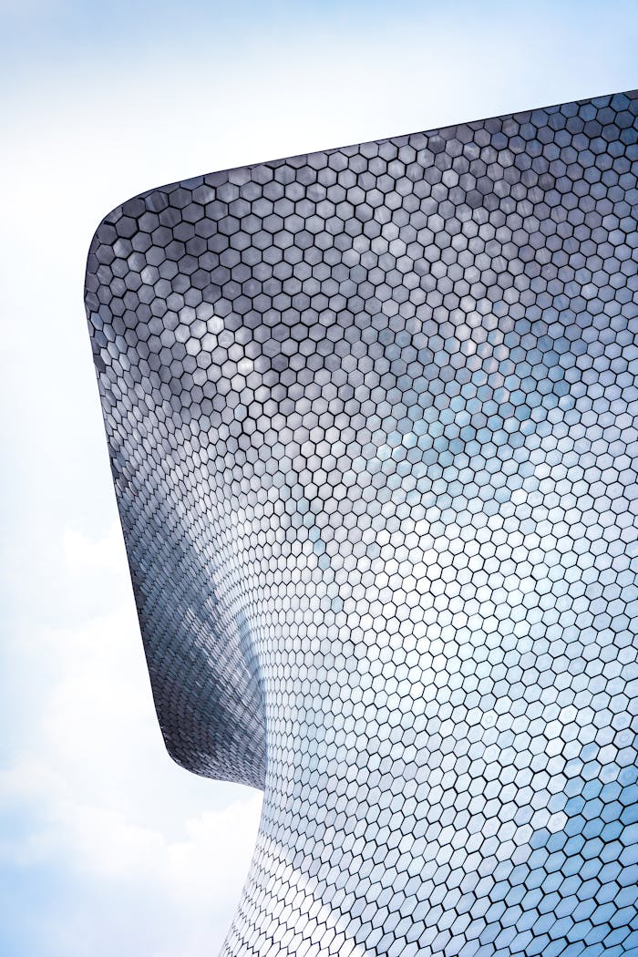 about-img Modern architectural design, geometric facade of Soumaya Museum in Mexico City.